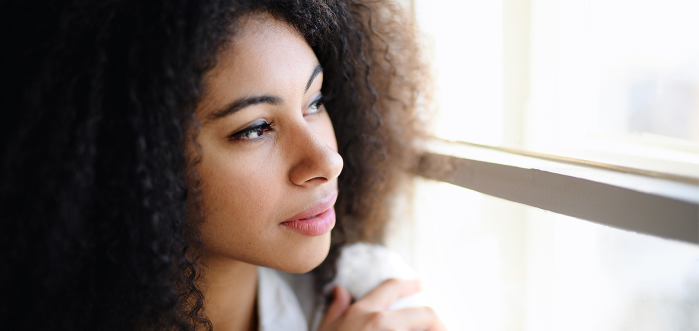 Woman looking out a window